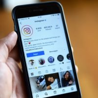 Close-up of a smartphone displaying an Instagram profile screen.